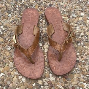 Tory Burch tan colored sandals with gold emblem
